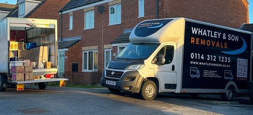 Whatley and Son Removals van loading furniture outside a home